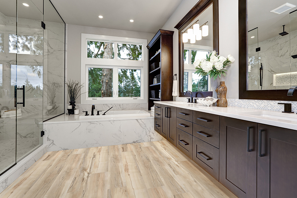master modern bathroom interior in luxury home with dark hardwoo
